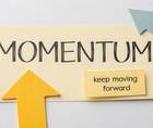 note that says momentum with an upward arrow