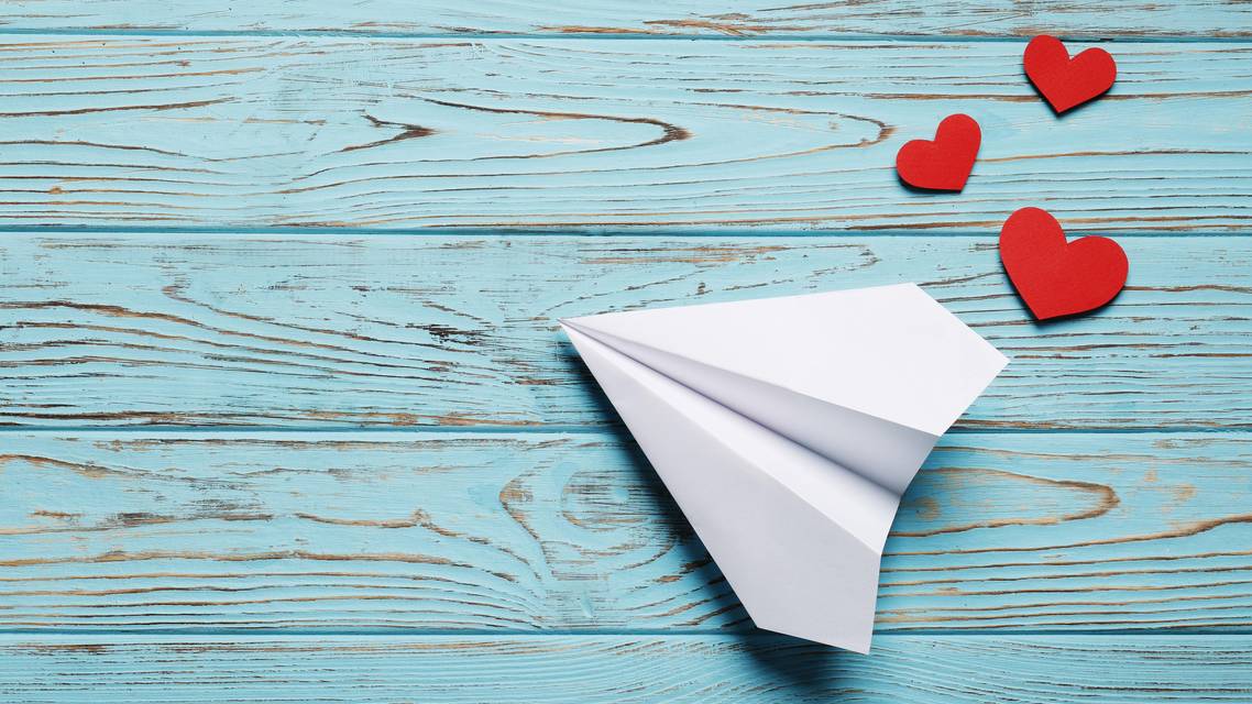 paper airplane with hearts