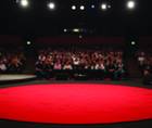 Image of a stage from a TEDx lecture